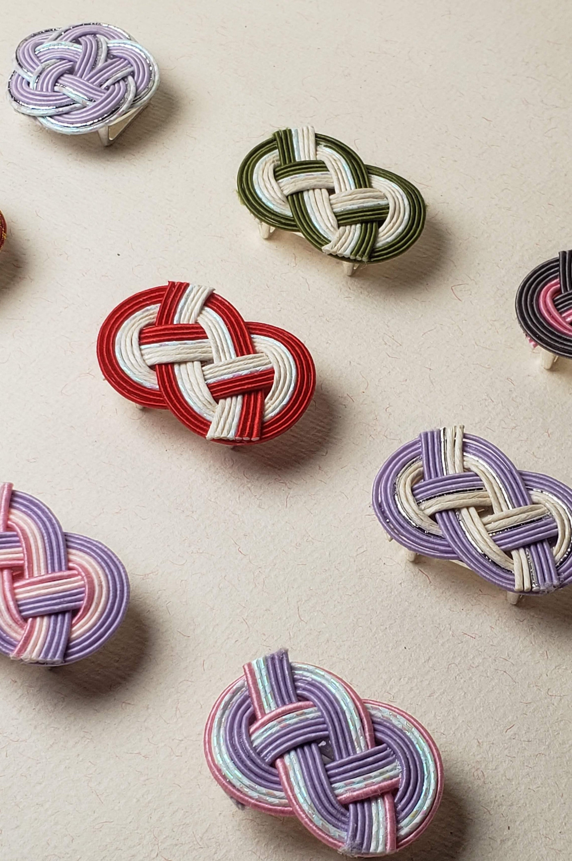 Close up a lot of mizuhiki awaji knot nd plum knot obidome, handmade by itookasi