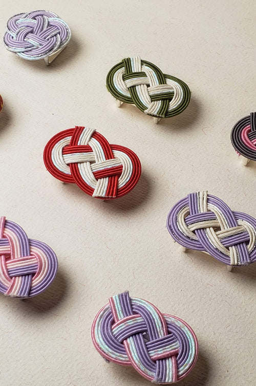 Close up a lot of mizuhiki awaji knot nd plum knot obidome, handmade by itookasi