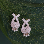 Close-up of cycle-up Mizuhiki Awaji knot earrings featuring German beads, handmade by Itookasi. The Awaji knot symbolizes a strong, lasting relationship.