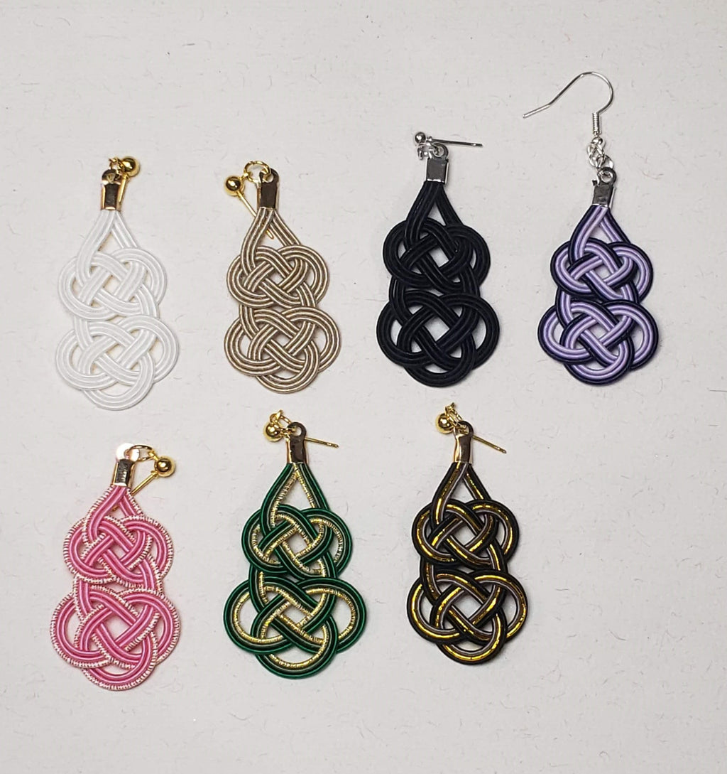 Close-up of 7 colors of gourd-shaped Mizuhiki awaji knot earrings handmade by Itookasi. A blend of Japanese craft and Finnish nature symbolizing strong bonds.
