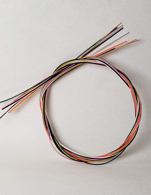 Close-up of Mizuhiki cords in different colors, imported from Japan by Itookasi. 