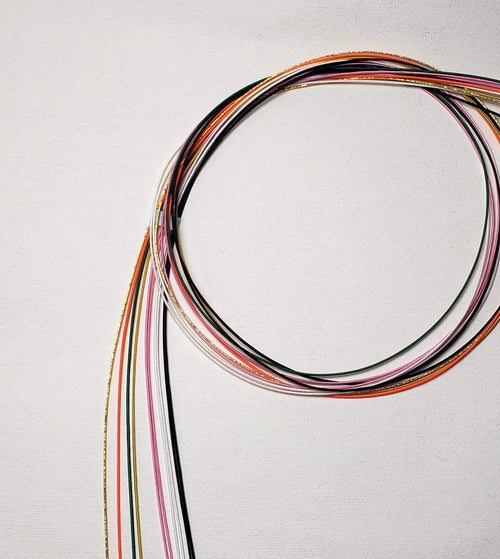 Close-up of Mizuhiki cords in different colors, imported from Japan by Itookasi. 