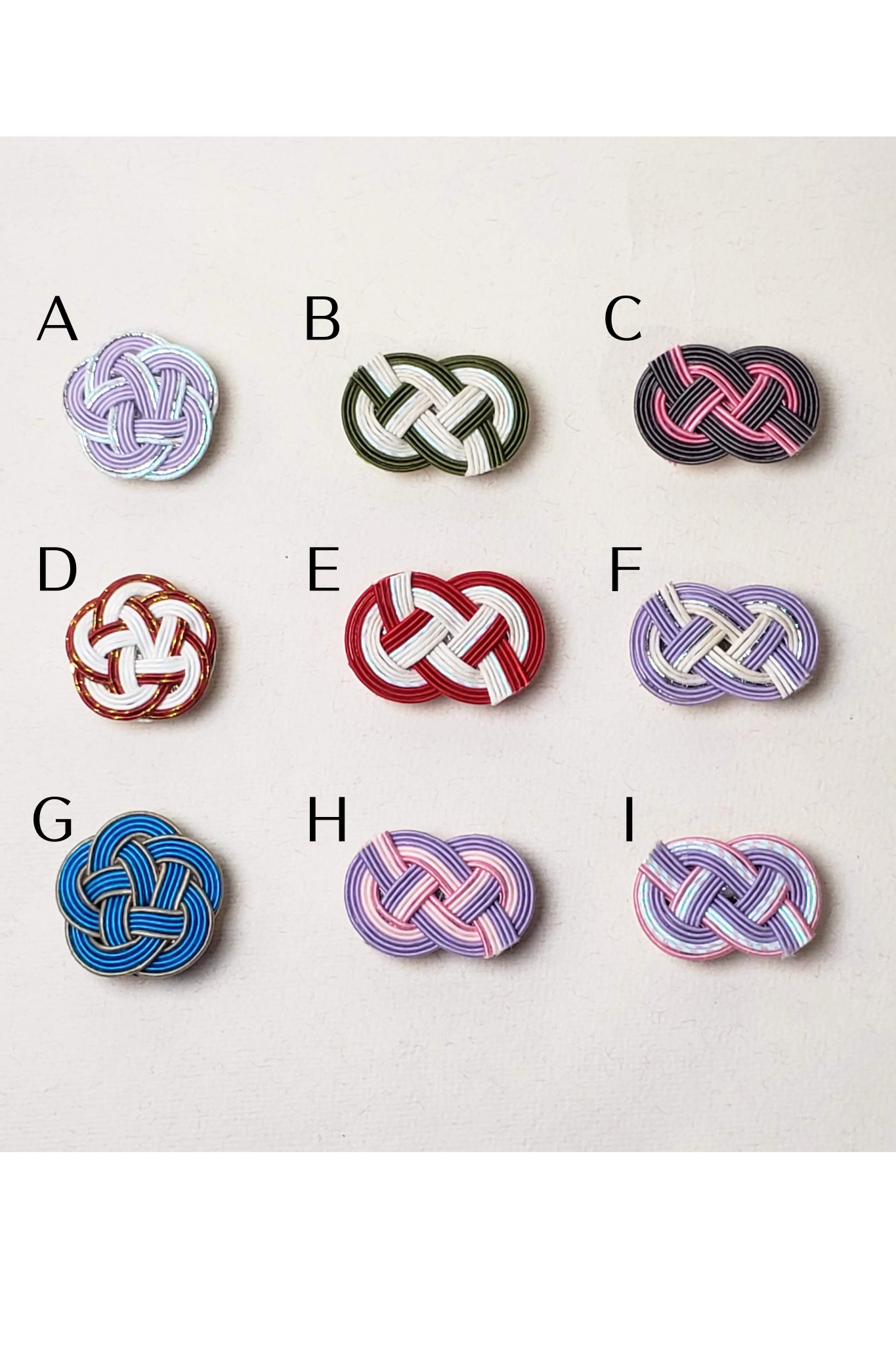 Close-up of Mizuhiki plum Knot and idaki-awaji knot obidome for kimono, handmade by itookasi for eternal bonds.