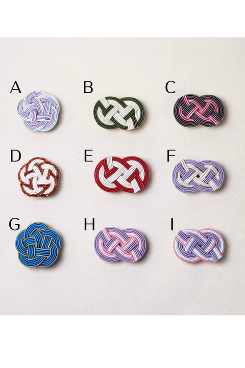 Close-up of Mizuhiki plum Knot and idaki-awaji knot obidome for kimono, handmade by itookasi for eternal bonds.