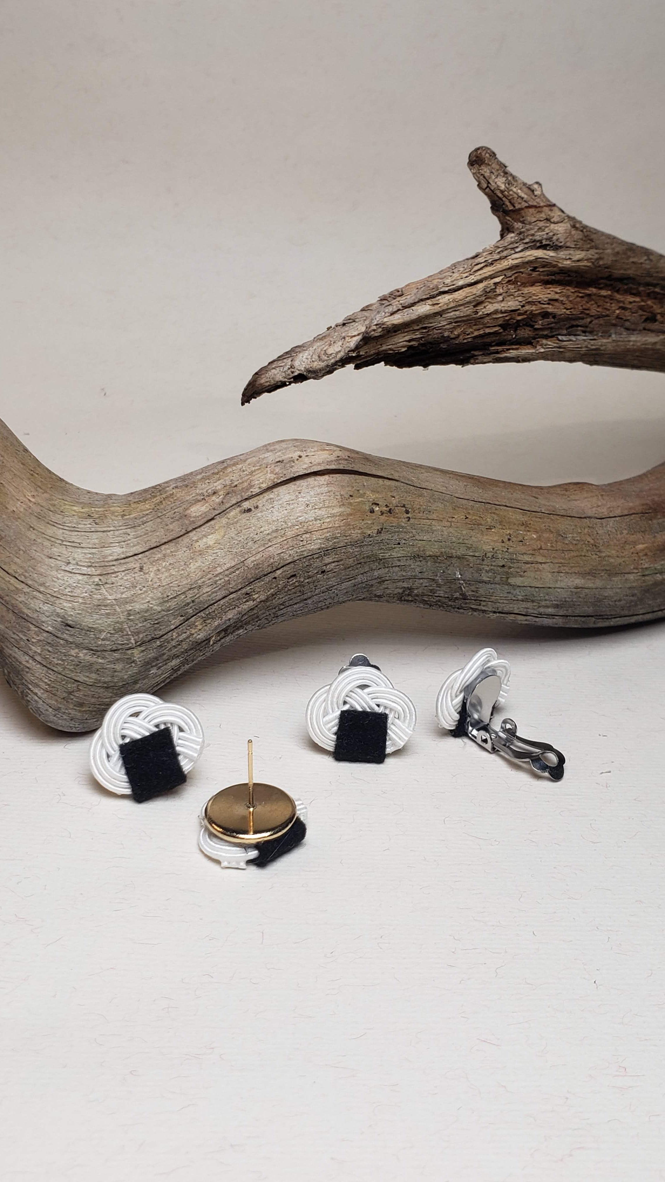 Close-up of the metal parts of the Awaji knot earrings with an onigiri (rice ball) design.