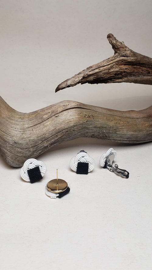 Close-up of the metal parts of the Awaji knot earrings with an onigiri (rice ball) design.